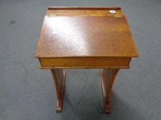 A pine child's desk with inkwell