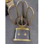A brass four-way folding spark guard together with a brass fire front and coal bucket