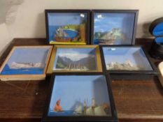 A box of six model ships in display frames - The Bismark etc