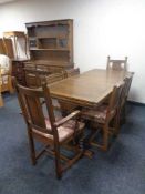 An Old Charm refectory extending table and harlequin set of six chairs.