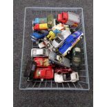 A wire basket containing mid century and later die cast vehicles, Corgi,