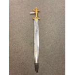 A gilt handled ornamental short sword