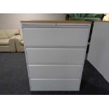 A four drawer metal document cabinet with oak effect top with key