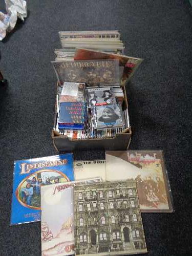 A box of CD's and vinyl LP's, The Beatles, Lindisfarne, Led Zeppelin,