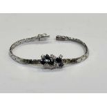 An 18ct white gold sapphire and diamond bracelet, approximately 1ct of diamonds, length 17.5cm.