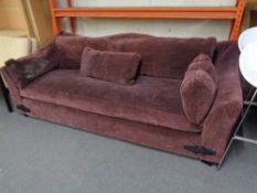 A large settee with cushion in purple fabric CONDITION REPORT: Approximately 240cm