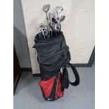 A Calloway golf bag containing irons and drivers