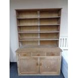 An antique pine kitchen dresser