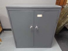 A mid century metal double door office cabinet, width 92 cm.