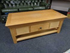 A contemporary oak coffee table fitted with two drawers