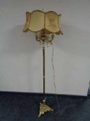 A continental brass standard lamp with shade