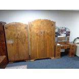 A three piece 1930's walnut bedroom suite - lady's and gent's wardrobe,