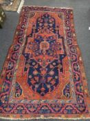 An antique Mahal rug, West Iran, 244 cm x 143 cm.