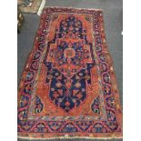 An antique Mahal rug, West Iran, 244 cm x 143 cm.