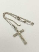 An 18ct white gold diamond set cross on chain CONDITION REPORT: Cross dimensions