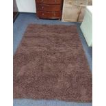 A brown shaggy rug