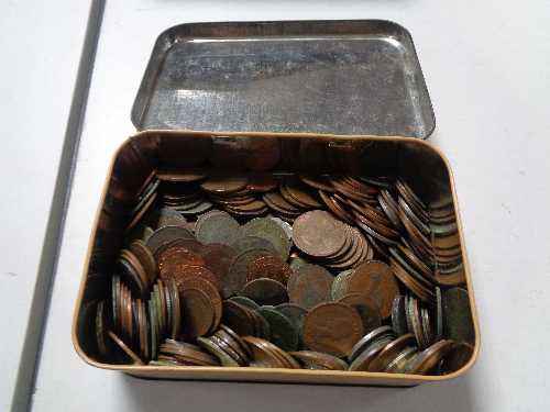 A vintage tin of coins,