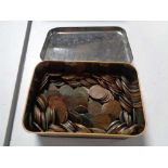 A vintage tin of coins,