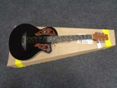 A six string acoustic guitar in retail box CONDITION REPORT: There are no makers