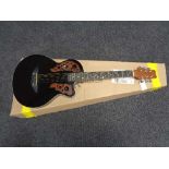 A six string acoustic guitar in retail box CONDITION REPORT: There are no makers