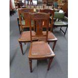 A set of three early 20th century carved oak dining chairs