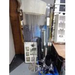 A metal standard lamp with shade and glass drops, box of curtain rails, table lamps,