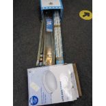 A box of curtain rails,