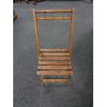 A twentieth century folding wooden child's chair