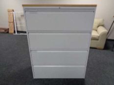 A four drawer metal document cabinet with oak effect top with key