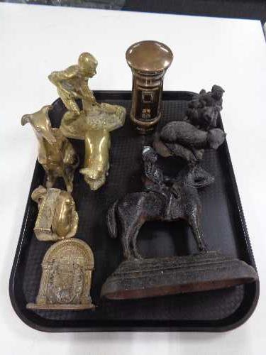 A tray of metal ware, brass miner, cast iron door stop,