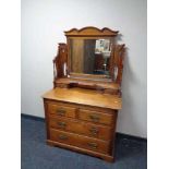 An Edwardian walnut dressing chest