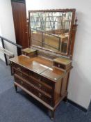 An Edwardian mahogany four drawer dressing chest