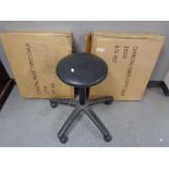 A swivel adjustable manicurist stool together with two boxed fabric typist chairs