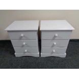 A pair of painted pine three drawer bedside chests