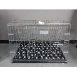 A folding black metal dog cage, height 67 cm, width 86 cm, depth 56 cm.