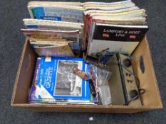 A box of magazines relating to trains,