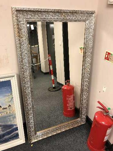 A Two-tone silvered framed mirror 4' x 2'