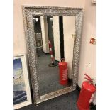 A Two-tone silvered framed mirror 4' x 2'