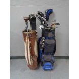 Two golf bags containing assorted irons and drivers