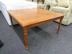 A square oak coffee table