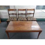 A set of three inlaid mahogany dining chairs together with a mahogany coffee table