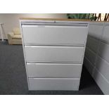 A four drawer metal document cabinet with oak effect top with key