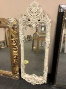 A cream fancy framed mirror