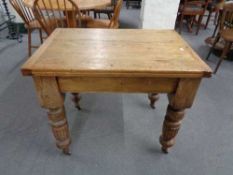 A Victorian pine turn over topped table. Height 74 cm x length 90 cm x width 63 cm.
