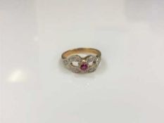 A 9ct gold diamond and ruby ring,