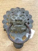 A nineteenth century Chinese bronze door knocker, 20 cm x 16 cm.