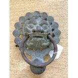 A nineteenth century Chinese bronze door knocker, 20 cm x 16 cm.