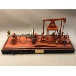 A large model Walking Beam Marine Engine 1904, on plinth under glass cover,