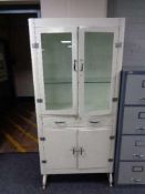 A mid century painted metal medical cabinet 85 cm x 176 cm x depth 40 cm.