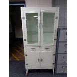 A mid century painted metal medical cabinet 85 cm x 176 cm x depth 40 cm.